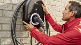 Man using the EON Home Charging Pod