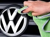 Close up of VW logo being polished
