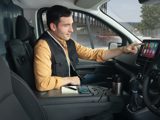 Man sat inside the Nissan Primastar using the infotainment system